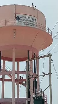 What happened that young man created a ruckus by climbing on a tank