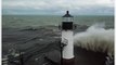 Large Waves Crash Against Michigan Lighthouse Amid Unseasonably Cold Temperatures