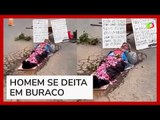 Homem se ‘sepulta’ em buraco para protestar no interior de Minas Gerais