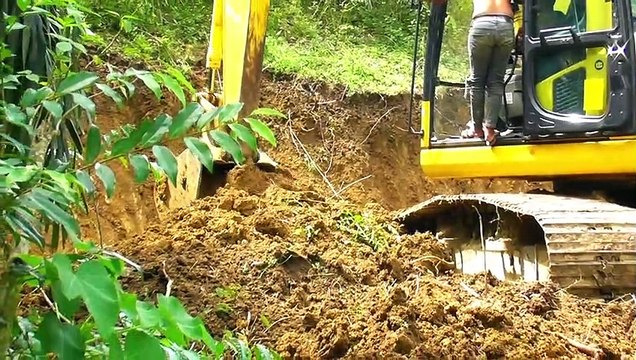 KOMATSU PC 195 LC Excavator Digging Soil in the Garden