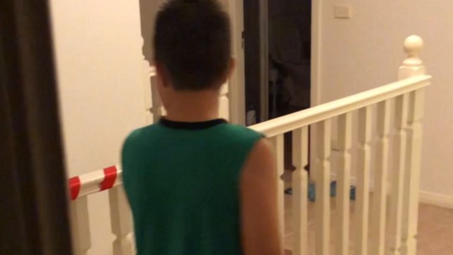 Playful dad pulls a ringing doorbell prank on his son