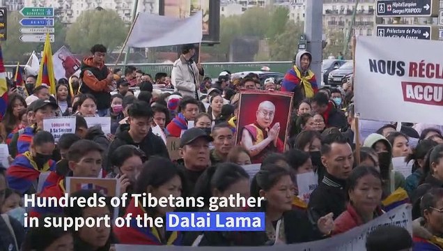 Hundreds of Tibetans gather in Paris to support Dalai Lama after controversial video