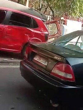 Two cars race at a speed of 100, after the collision, one entered the boundary of Shaheed Park and the other broke the shutter in the general stores.