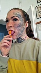 Woman Grabs Carrot With Her Split Tongue