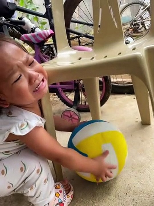 Toddler Struggles to Retrieve Ball
