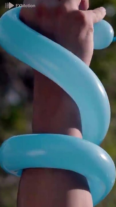 Slow motion breaks a water balloon