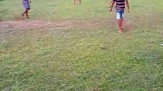 Village Football Match  . Indian Village boys playing football  in the green field