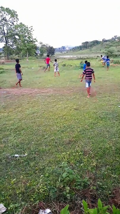 Village Football Match  . Indian Village boys playing football  in the green field