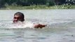 Young people are bathing and swimming in the dam of the village Indian youth swimming in a beautiful natural dam