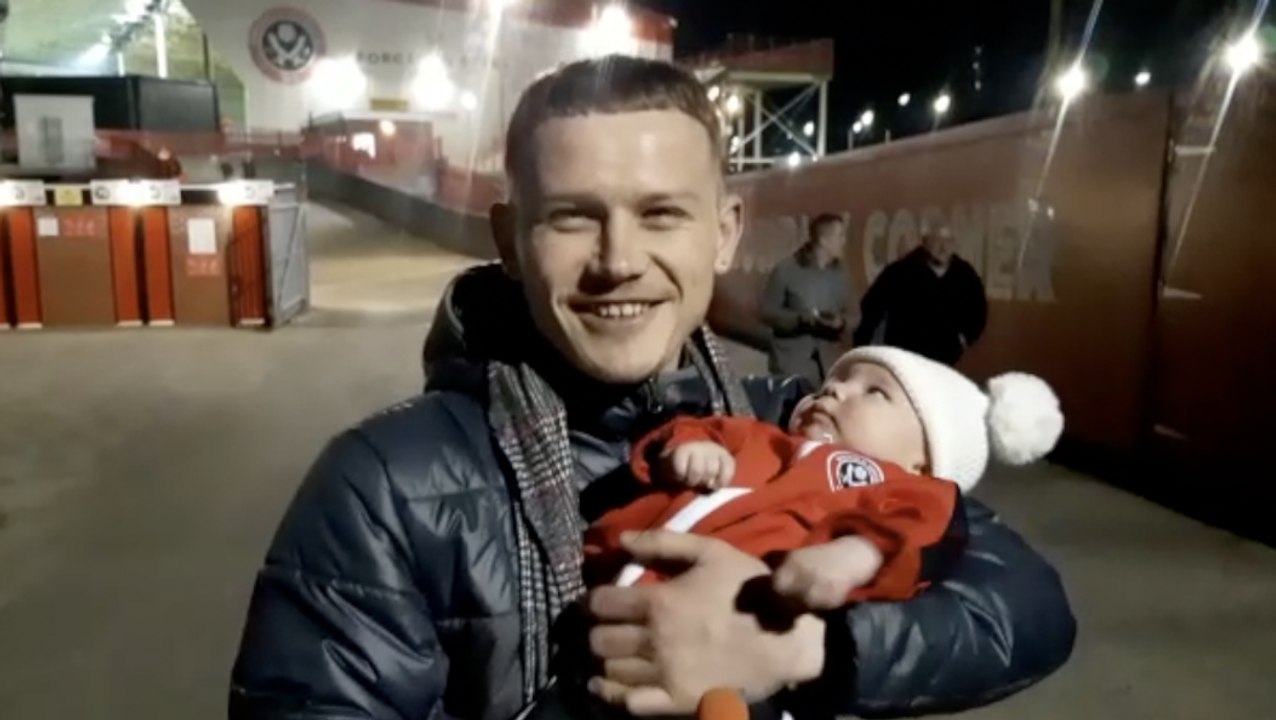 Delighted Blades fans celebrate as Sheffield United are promoted to the Premier League