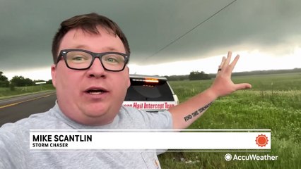 Download Video: Wall cloud lowers as storm chasers pursue tornado-warned storms in Texas