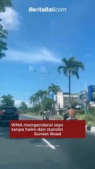 WNA mengendarai sepeda motor tanpa helm dan standing di Jalan Sunset Road, Kamis (27/4).