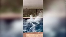 Large hail the size of BASEBALLS hits swimming pool in Texas