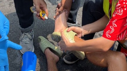 Man is rescued by helpful Thai people after getting flip-flop stuck on his foot during Songkran