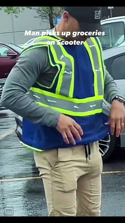 Man Picks Up groceries on Scooter