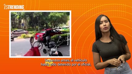 Policía quedó sobre el capó de un auto cuando este trataba de huir