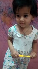 Trishu with tooth brush & saying paste-dm