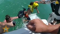 Moment father and son rescued after strong rip current pulls them out to sea