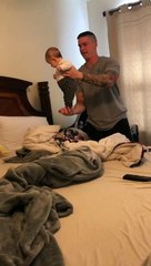 Baby with dad entertained