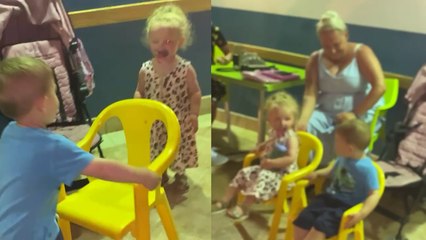 CHARMING LITTLE GENT pulls up a chair for a girl before sitting next to her!