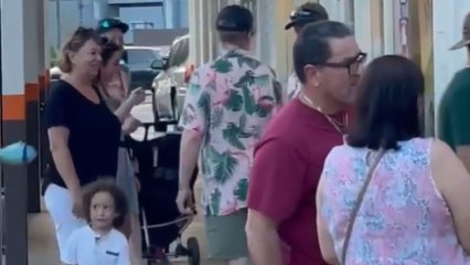 Man rejoices with the stranger family wearing the same shirt as him