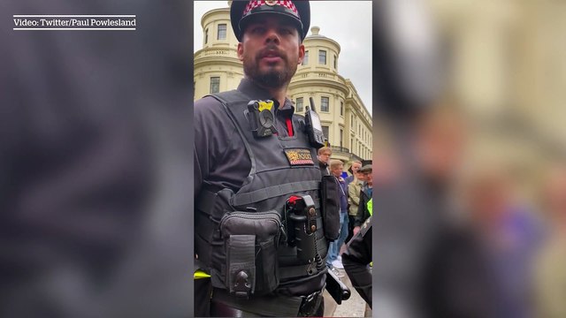 Policeman tells protestors they may be arrested for public nuisance for chanting 'Not My King'
