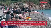 Antalya’da dün savaş alanına dönen sahilde bugün sıcak hava keyfi
