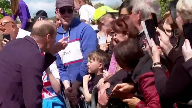 Prince William and Princess Kate joke with children as they greet royal fans at Windsor Castle