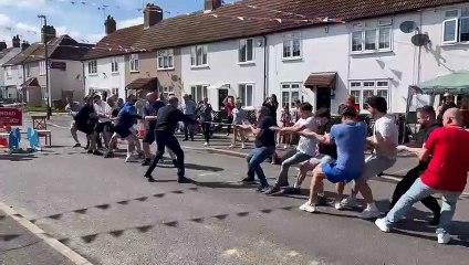 Hilarious moment rope snaps during game of tug of war in celebration of the king's coronation