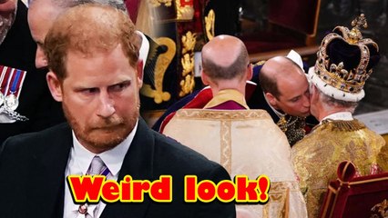 Prince Harry was spotted looking odd as Prince William kissed their father
