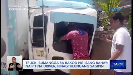 Descargar video: Truck, bumangga sa bakod ng isang bahay; naipit na driver, pinagtulungang sagipin | Saksi