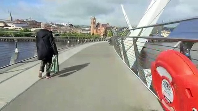 A cycle over the Peace Bridge on a sunny Derry day