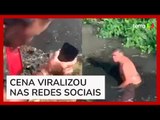 Homem pula em esgoto no Rio de Janeiro para recuperar Iphone