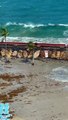 Couple Gets Knocked Off Path By Waves