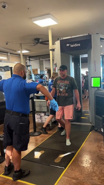 TSA Agent Makes Man Do the Robot