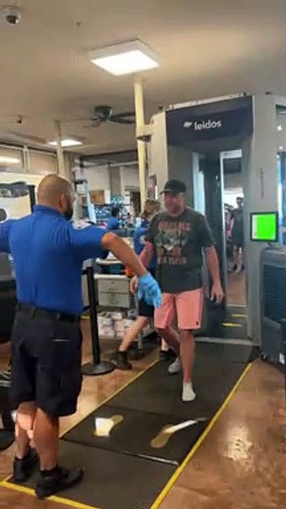TSA Agent Makes Man Do the Robot