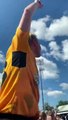 Cambridge United's Liam Bennett is lofted on a supporter's shoulders after he helped the U's achieve League One survival