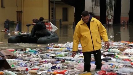 Garbage and floodwater fill up streets in Italy, disrupting tourist season