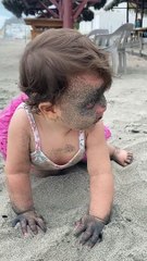 Girl Gets Face Full of Sand at the Beach