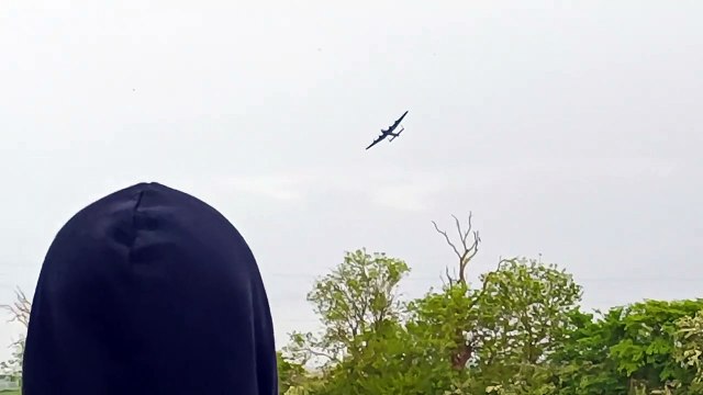 The Lancaster Bomber flies over Blyton Airfield in Lincolnshire to mark the 80th anniversary of the Dambusters raids.
