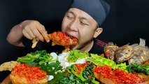 Mukbang Chicken geprek in spicy sauce, tilapia fish, spinach, lettuce and a bowl of rice