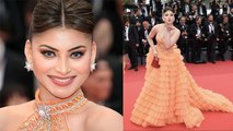 Cannes 2023 Red Carpet: Urvashi Rautela Orange Frill Gown Look के साथ Red Mini Bag Viral ।