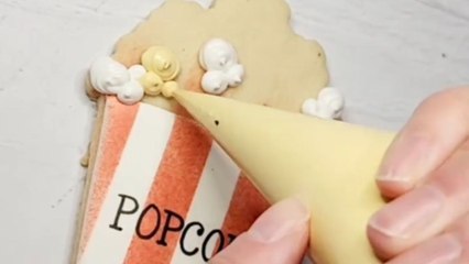Cookie artist reveals the splendid art of turning a tasty cookie into a POPCORN tub