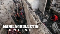 Residents look for scrap metal and things to sell or use from their destroyed houses due to a fire that razed in Brgy. San Antonio, Parañaque City, on Thursday