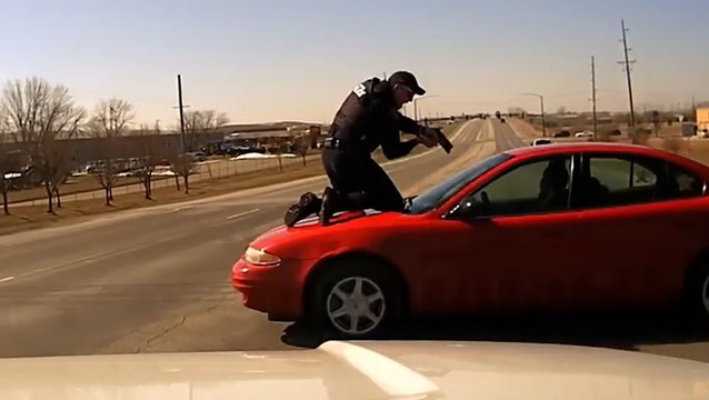 Watch: Police officer clings to car bonnet as suspect speeds off
