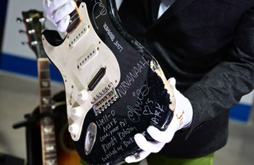 Kurt Cobain’s smashed black Fender Stratocaster fetched an “astounding” near $600,000 at auction