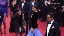 Olivia Culpo reveals her ample cleavage in a head turning black and purple gown at the Asteroid City premiere during Cannes Film Festival