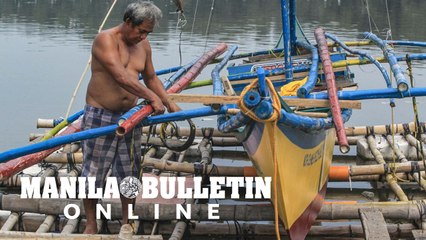Fishermen secure their boats as the country prepares for 'Mawar'