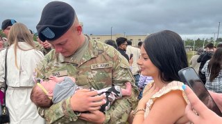Military Twin Fights Back Tears When He Holds Niece For First Time