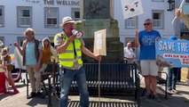 Protestors boo a Welsh Water van as it passes through Brecon